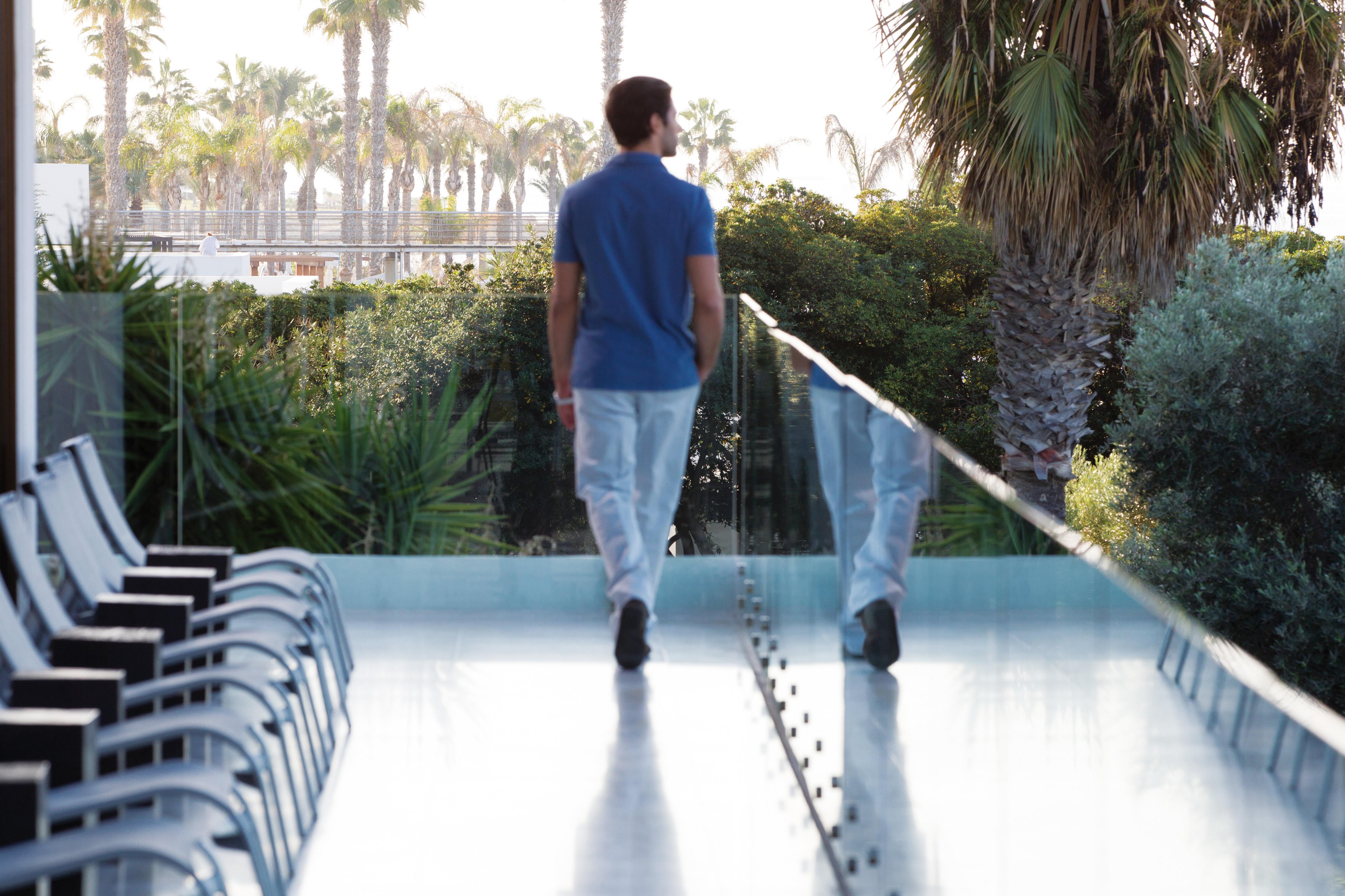 Hotel Almyra Paphos Exteriér fotografie A man walking